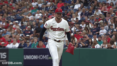 Baseball Player In Guardians Jersey In Front Of Union Home Sign GIF