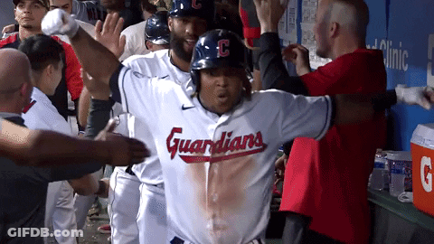 Baseball Player In Guardians Jersey Surrounded By Teammates GIF