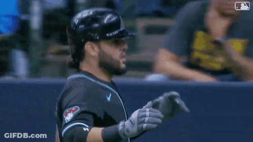 Baseball Player In Helmet And Catcher's Gear In Dugout GIF
