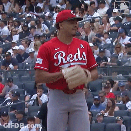 Baseball Player In Helmet And Gloves On Field GIF