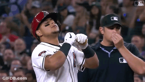 Baseball Player In Helmet And Nike Gloves Facing Referee GIF
