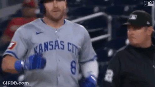 Baseball Player In Kansas City Uniform Walking Towards Referee GIF