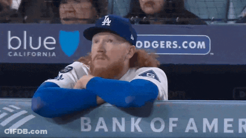 Baseball Player In LA Hat And Glove Covering Face GIF