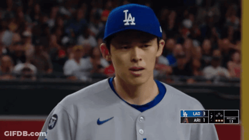 Baseball Player In LA Hat Looking Down GIF