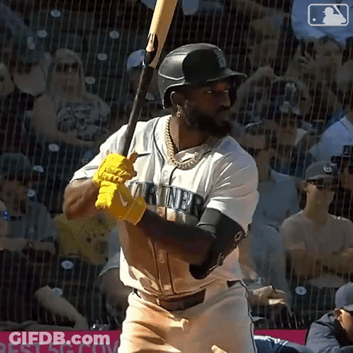 Baseball Player In Mariners Jersey Swinging Bat GIF