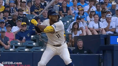 Baseball Player In Milwaukee Jersey Swinging Bat GIF