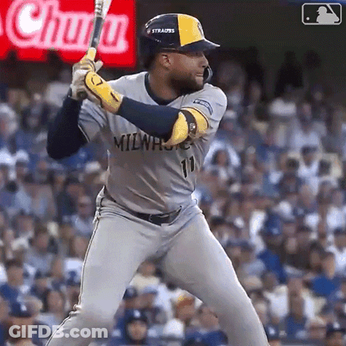Baseball Player In Milwaukee Uniform Swinging At Ball GIF