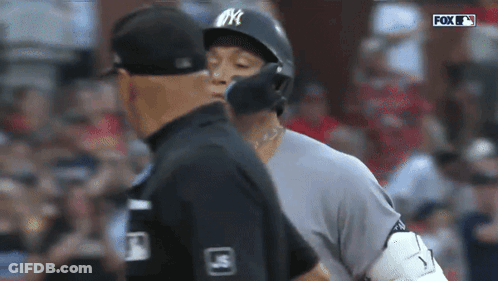 Baseball Player In NYC Helmet Talks To Referee GIF