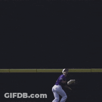 Baseball Player In Purple Uniform Sliding Into Base GIF