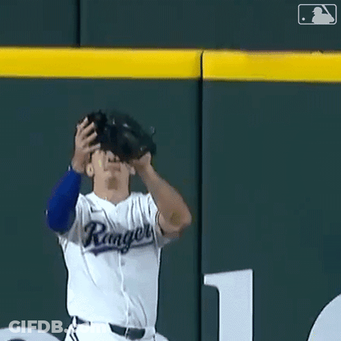 Baseball Player In Rangers Uniform Catching Ball GIF