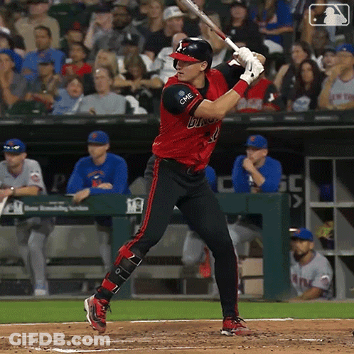 Baseball Player In Red And Black Bulls Uniform Swinging At Pitch GIF