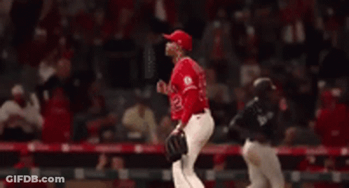 Baseball Player In Red Uniform Number 32 GIF
