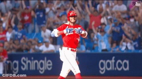 Baseball Player In Red Uniform Running Past Shingle Sign GIF
