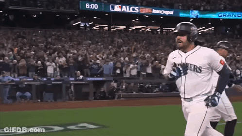Baseball Player In Seahawks Jersey Running To Home Plate GIF