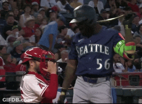 Baseball Player In Seattle Uniform Standing In Front Of Catcher GIF