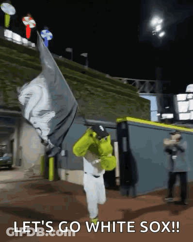 Baseball Player In Shrek Costume Holding Flag Saying Let's Go White Sox GIF