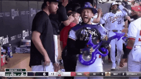 Baseball Player In Twins Jersey Holding Blue Balloon GIF