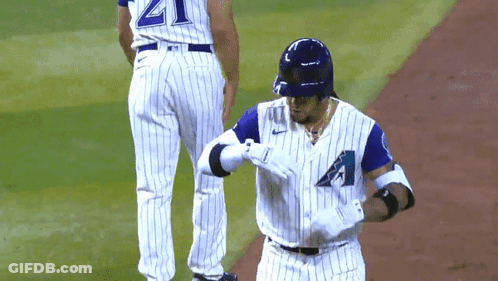 Baseball Player In White And Blue Uniform With Letter A GIF