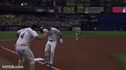 Baseball Player In White And Purple Uniform GIF