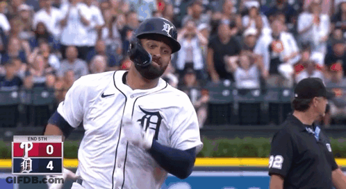 Baseball Player In White Tiger Jersey Running To Home Plate GIF