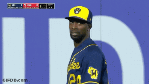 Baseball Player In Yellow Hat And Blue Jersey Number 24 GIF