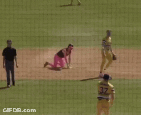 Baseball Player Kneeling In Pink Pants And Helmet GIF