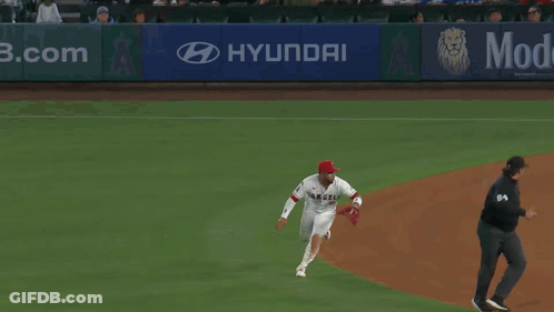 Baseball Player Laying On Ground With Scoreboard Saying Mid Eighth GIF