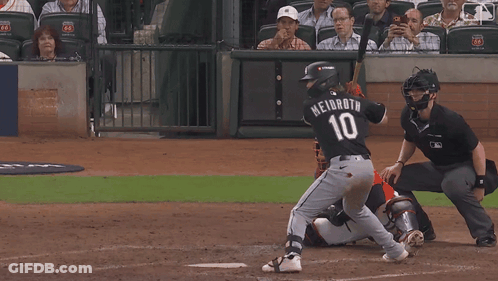 Baseball Player Number 10 Swinging At Ball GIF
