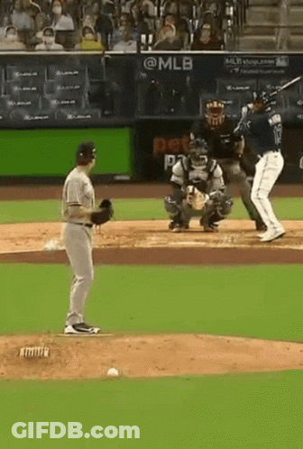 Baseball Player Number 12 Swinging At Pitch GIF