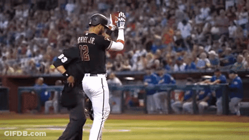 Baseball Player Number 12 Talking To Another Player GIF