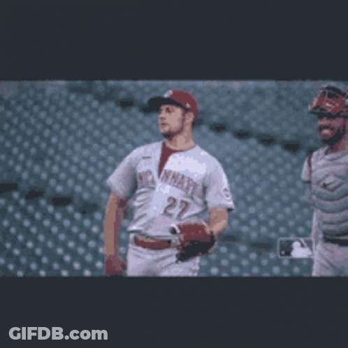 Baseball Player Number 27 Walking With Catcher GIF
