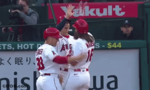 Baseball Player Number 33 Hugging Another Player GIF