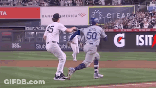 Baseball Player Number 50 Running Toward Another Player GIF