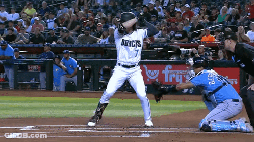 Baseball Player Number 7 Swinging At Ball GIF