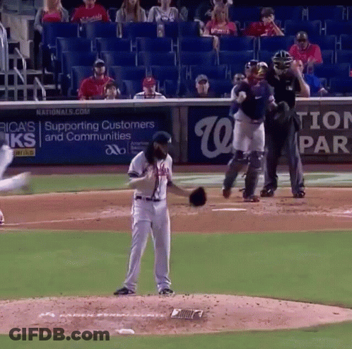 Baseball Player On Mound In Front Of Nationals Banner GIF