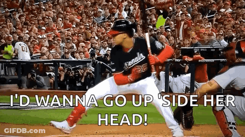 Baseball Player Ready To Hit Ball As Crowd Watches GIF