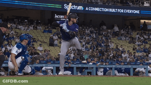 Baseball Player Ready To Swing At Pitch With Spectrum Sign GIF