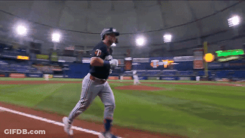 Baseball Player Running On Field With Coca-Cola Sign GIF
