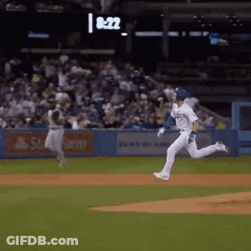 Baseball Player Running To Catch Ball, Another Watches GIF