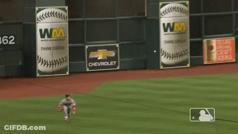 Baseball Player Running To Catch Ball In Front Of Chevrolet Sign GIF