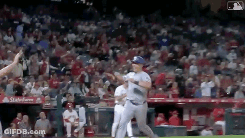 Baseball Player Running To Dugout With Crowd GIF