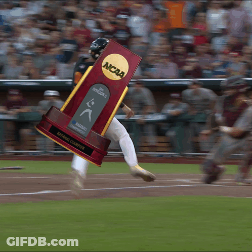 Baseball Player Running With NCAA Trophy GIF