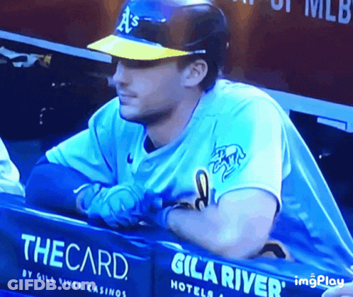 Baseball Player Sitting In Dugout With The Card Sign GIF