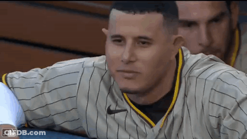 Baseball Player Sitting In Striped Jersey GIF