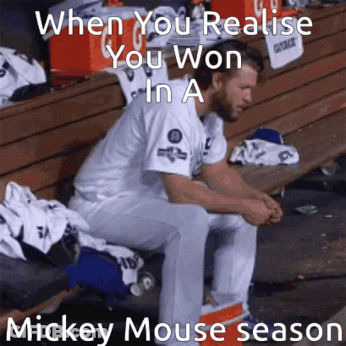 Baseball Player Sitting On Bench Saying When You Realize You Won In A Mickey Mouse Season GIF