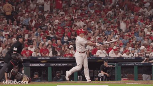 Baseball Player Sliding Into Base With Referee Watching GIF