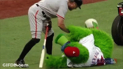 Baseball Player Standing Next To Green Mascot With Letter P GIF