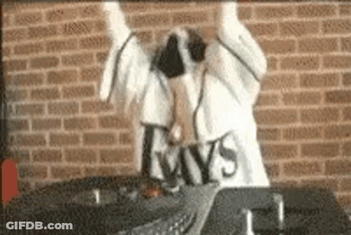 Baseball Player Surrounded By Teammates GIF