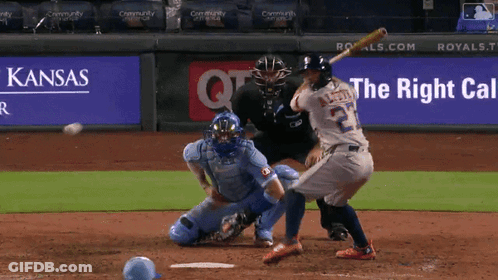 Baseball Player Swinging At Ball In Front Of Kansas Ad GIF