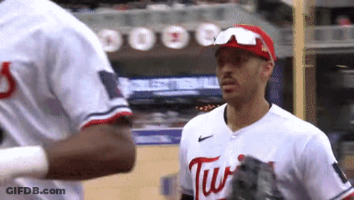 Baseball Player Swinging At Ball With Rally Sausage GIF
